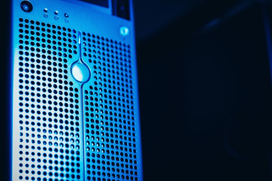 Modern server rack with blue lighting in a secure data center environment.
